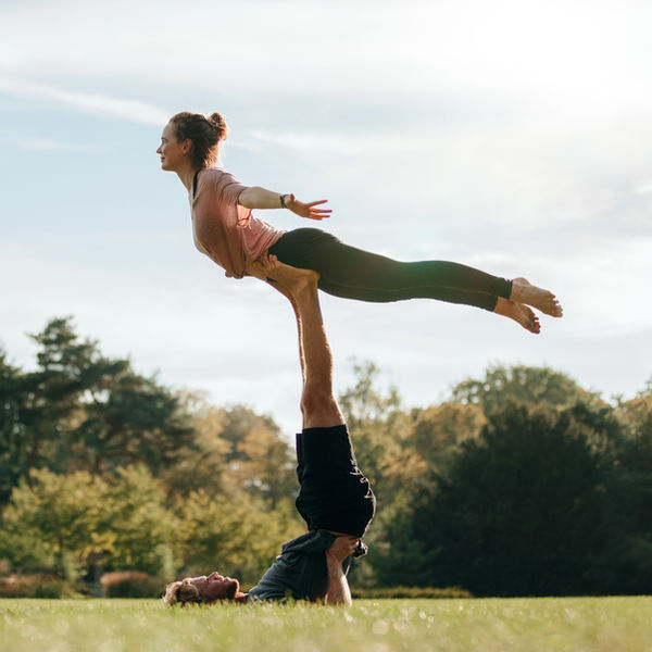 Two people supporting each other outdoors