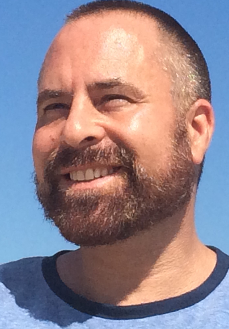 Oliver Olwyn smiling outdoors